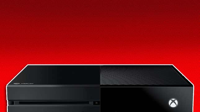 A black Xbox One console lays flat against a red background.