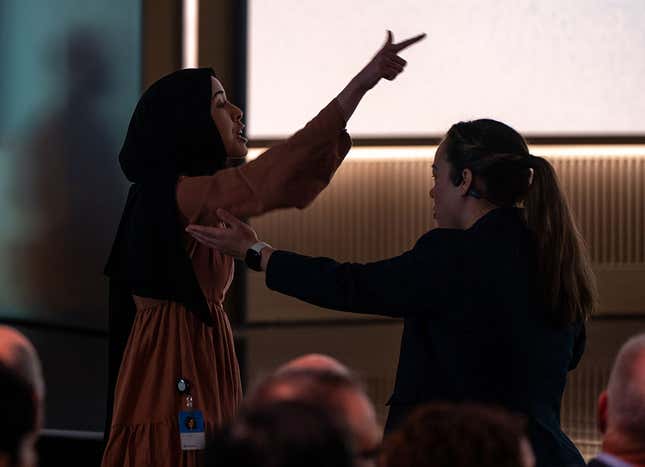 A protestor confronts Microsoft AI CEO Mustafa Suleyman during an event highlighting Microsoft Copilot agents, the company's AI tool, on April 4, 2025 in Redmond, Washington.
